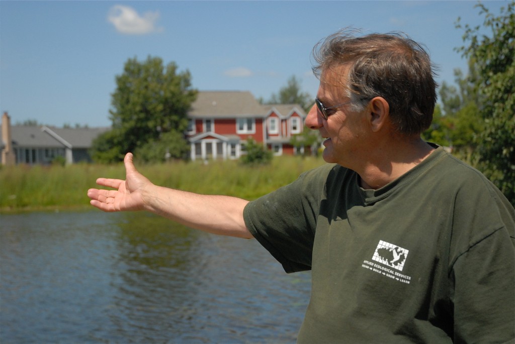 Steve Apfelbaum shows us the lake at Prairie Crossing where the water has been filtered by the native plant landscape and is pure enough to swim in.
