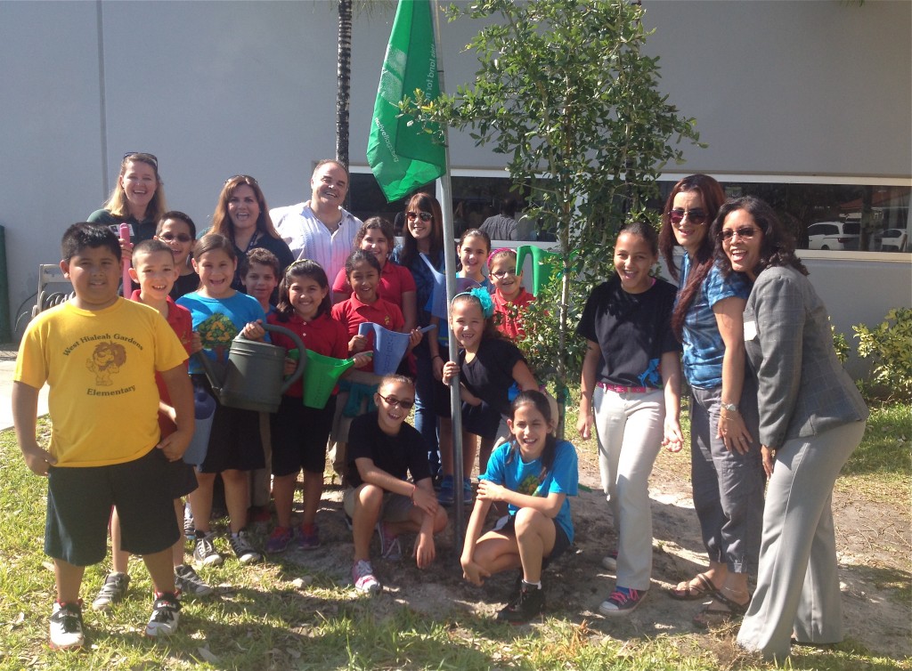 Students at West Hialeah Gardens students plant a tree in an Earth Day observance. photo Catherine B. Zimmerman